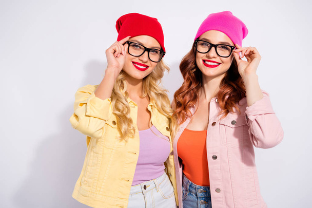 Photo of two pretty confident ladies wear specs casual clothes isolated white background - Foto, immagini