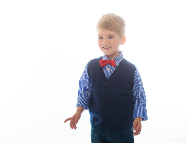 Little boy in blue vest with red bow tie - Foto, afbeelding