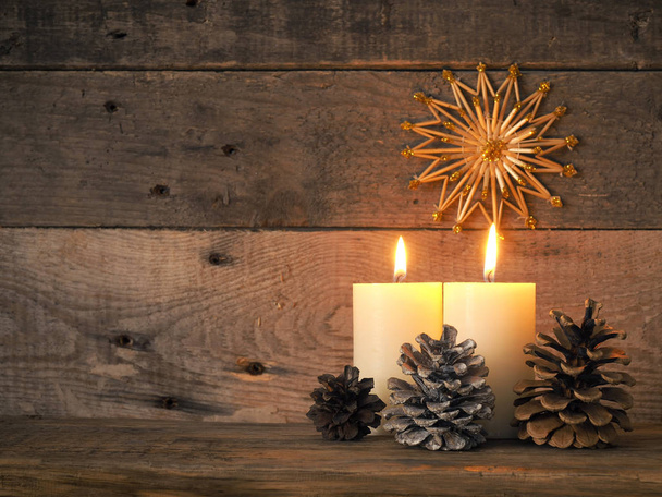 Two Advent candles burning - Фото, изображение