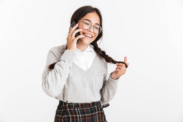 Photo closeup of adorable teenage girl wearing eyeglasses and sc - Foto, immagini