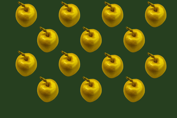 isolated collage of golden apples on a green background - Fotoğraf, Görsel