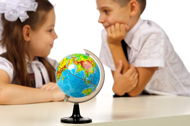 boy and girl with globe - Foto, Imagen