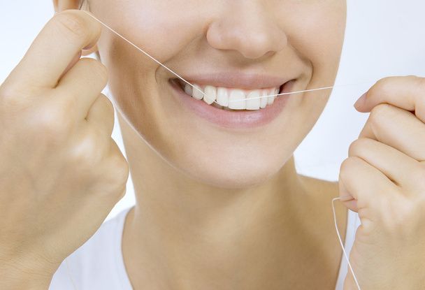 Woman and teeth floss - Photo, Image
