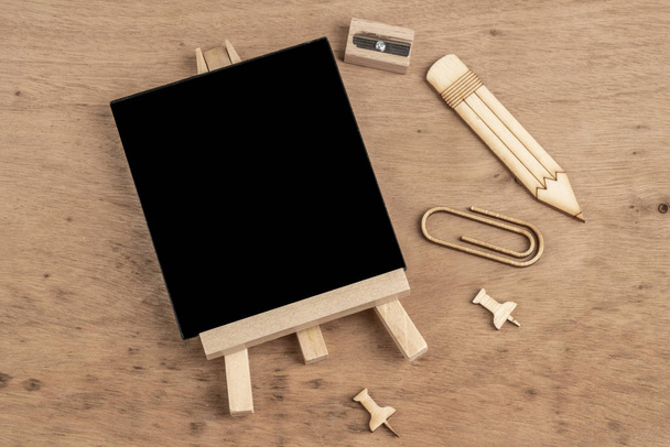 back to school template with a chalk board and pencils on table - Fotografie, Obrázek