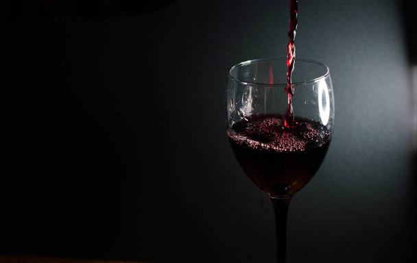 Wine glass with red wine - Foto, imagen