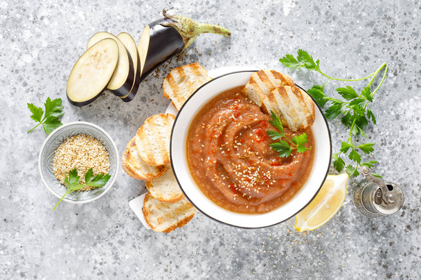 Eggplant hummus with ingredients for cooking. Traditional vegan arabic aubergine appetizer. Baba Ghanoush - Fotografie, Obrázek
