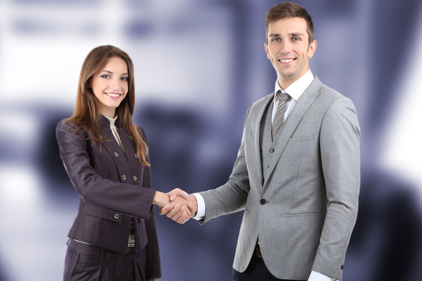 Business colleagues shaking hands at office - Photo, Image