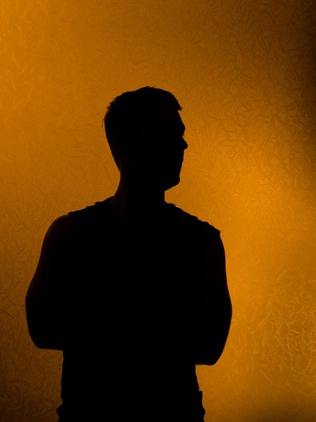 Confidence. Back lit silhouette of man - Foto, afbeelding