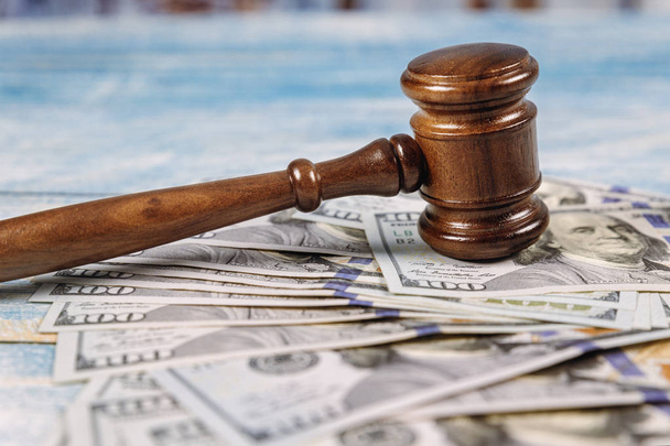 Court gavel and money on blue background. - Photo, Image