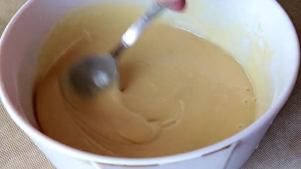 mixing pastry in a glass bowl - Video, Çekim