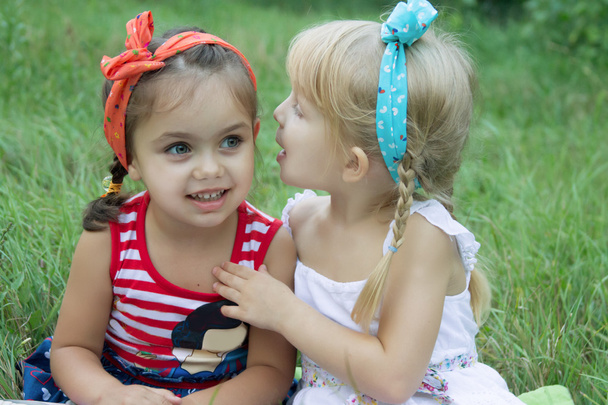 Two girls sharing secrets - Photo, Image