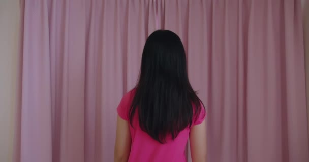 slow motion woman opening curtain - Felvétel, videó