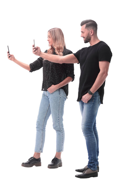 in full growth. stylish young couple taking selfie - Zdjęcie, obraz