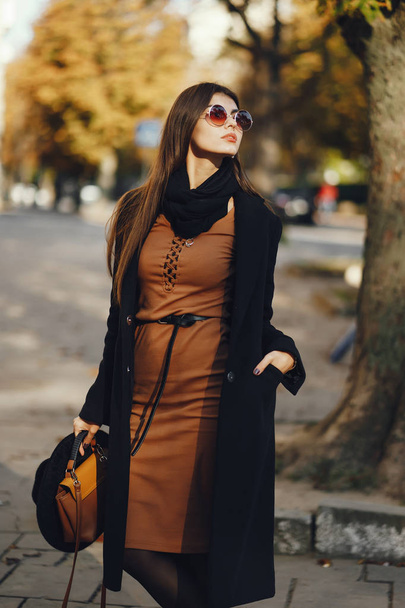 stylish girl walking through the city - Zdjęcie, obraz