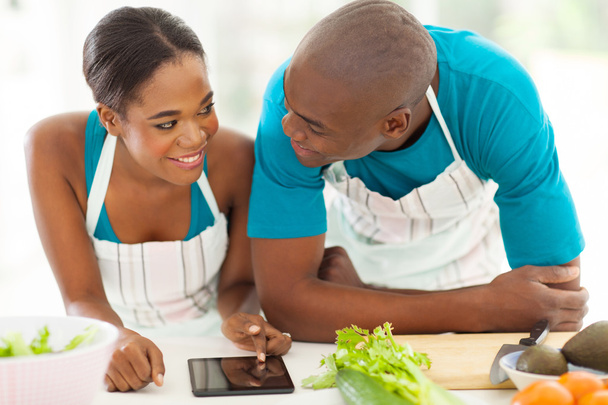 young african american couple searching for a recipe - Foto, afbeelding