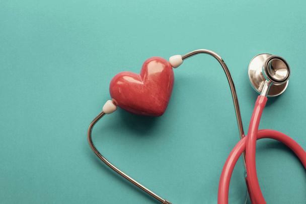 Red heart with stethoscope, heart health,  health insurance conc - 写真・画像