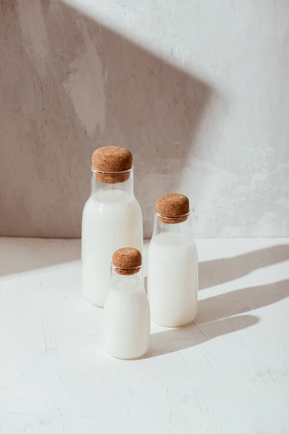 Milk or cocktail creative concept, minimalism styled, angle view, space for a text. - 写真・画像