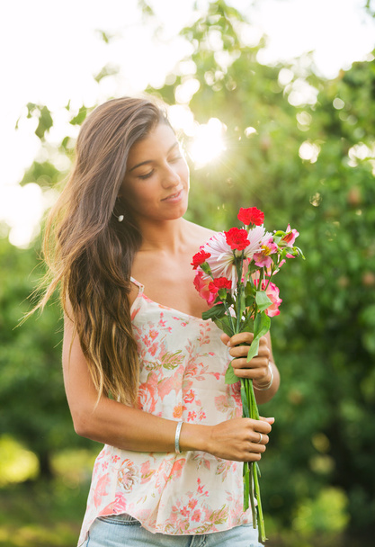 Young Woman with Flowers - Fotoğraf, Görsel