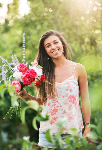 Young Woman with Flowers - Photo, image