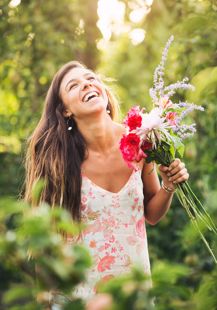 Young Woman with Flowers - Foto, Imagen