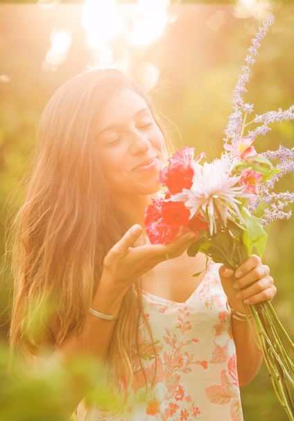 Young Woman with Flowers - Фото, зображення