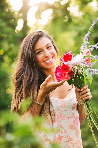 Young Woman with Flowers - Zdjęcie, obraz