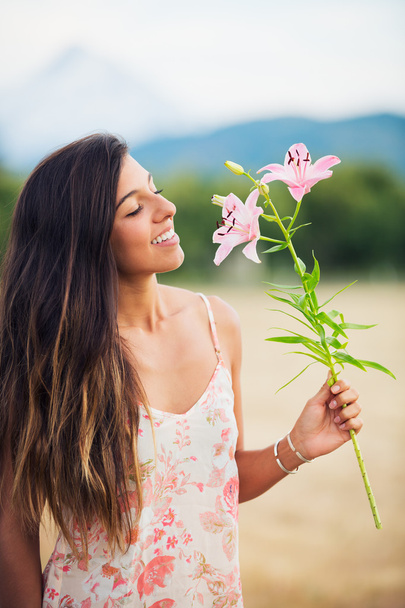 Young Woman with Flowers - Foto, Imagen