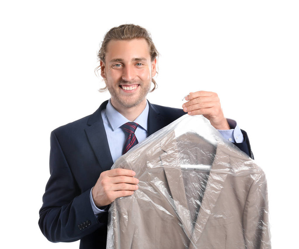 Businessman with clothes after dry-cleaning on white background - Фото, изображение