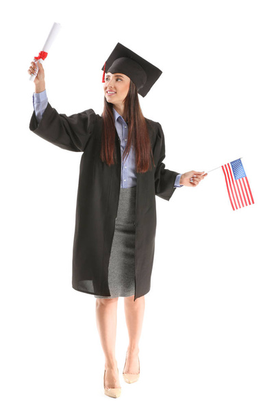 Female graduate with diploma and USA flag on white background - Photo, Image