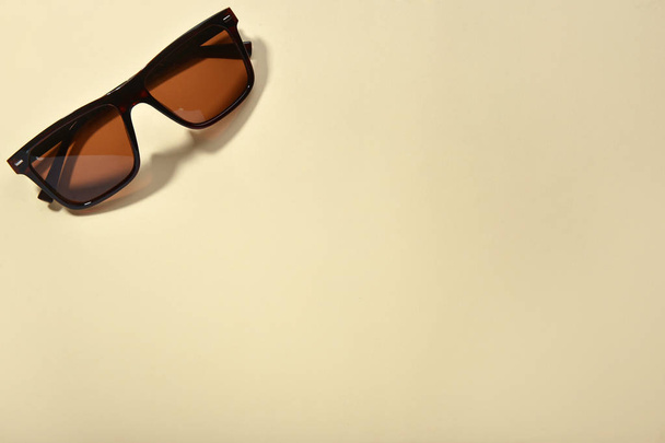 Stylish sunglasses on light background - Фото, изображение