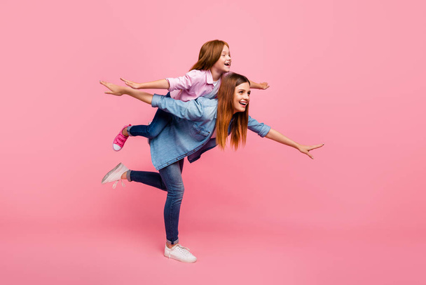 Funny foxy little lady and her mom participants ready steady go wear casual clothes isolated pink background - Fotografie, Obrázek