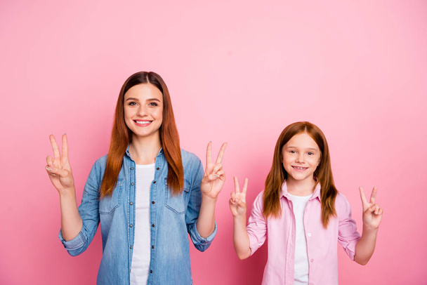 Pretty foxy small lady and her mom showing v-sign symbol wear casual clothes isolated pink background - Photo, Image