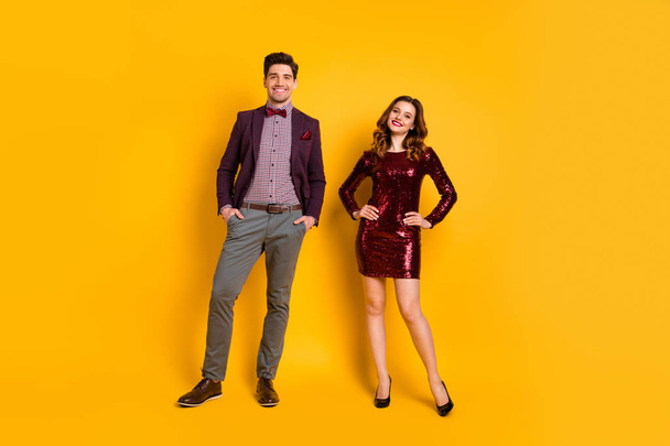 Full length body size view portrait of his he her she nice-looking attractive smart content cheerful cheery gentleman lady posing isolated over bright vivid shine yellow background - Zdjęcie, obraz