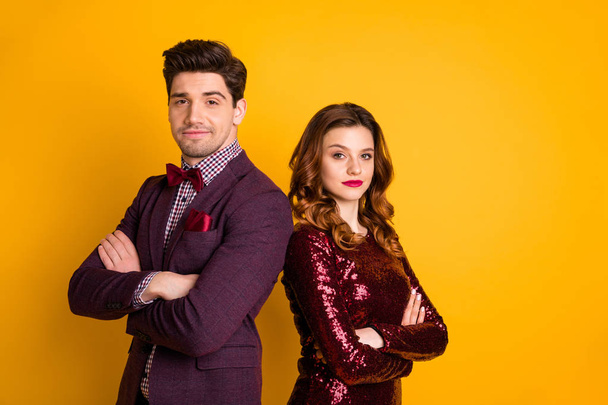 Portrait of his he her she nice attractive elegant charming smart serious content people standing back to back folded arms isolated over bright vivid shine yellow background - Foto, Bild