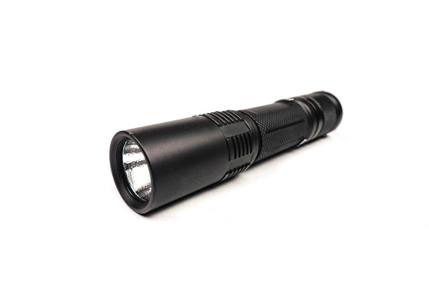 black long flashlight isolated on white background. - Photo, Image