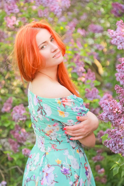 pretty redheaded girl walking in the summer park - Valokuva, kuva