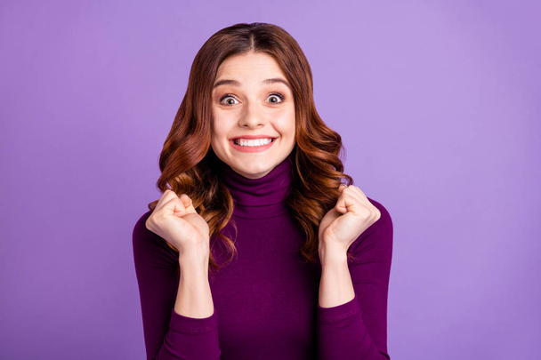 Close-up portrait of her she nice attractive lovely funny cheerful cheery optimistic wavy-haired girl holding fists good great news isolated over bright vivid shine purple violet lilac background - Zdjęcie, obraz