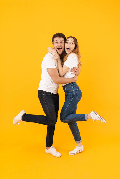 Full length portrait of happy couple man and woman in basic t-sh - Foto, Imagen
