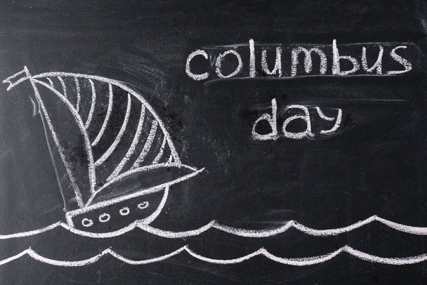 chalkboard with ship drawing and Columbus Day inscription - 写真・画像