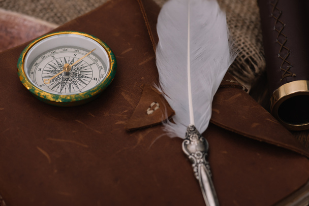 nib and compass on leather copy book on hessian - Foto, imagen