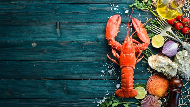 Seafood on a blue background. Lobster. Top view. Free copy space. - Fotoğraf, Görsel