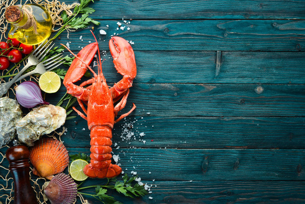 Seafood on a blue background. Lobster. Top view. Free copy space. - Φωτογραφία, εικόνα