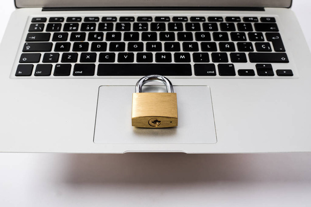 golden padlock on a laptop - Photo, image