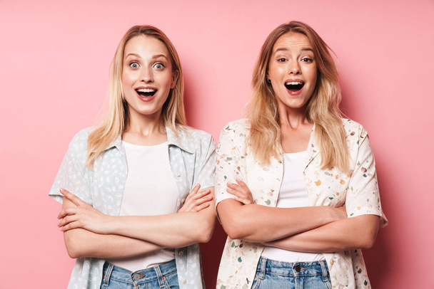 Two attractive blonde girls wearing summer outfit - Fotografie, Obrázek