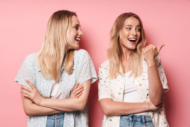 Two attractive blonde girls wearing summer outfit - Fotografie, Obrázek