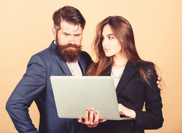 Discussing progress. Woman and guy colleague working together. Business plan. Business lady and director or boss surfing internet. Business meeting. Man bearded manager show financial report laptop - Foto, Imagen