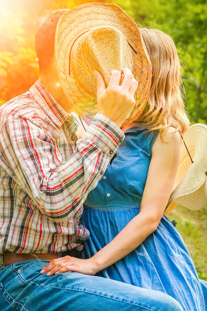 happy cowboys couple outdoors in the park - Photo, Image