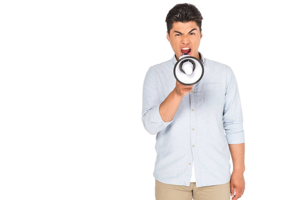 angry asian man screaming into megaphone while looking at camera isolated on white - Foto, afbeelding