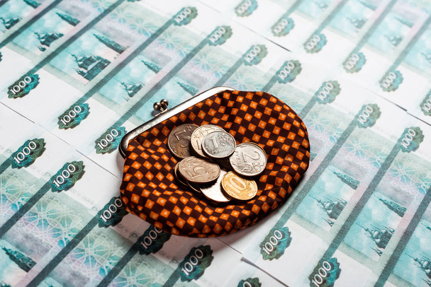 silver and golden coins on plaid vintage wallet and russian money  - Foto, Bild