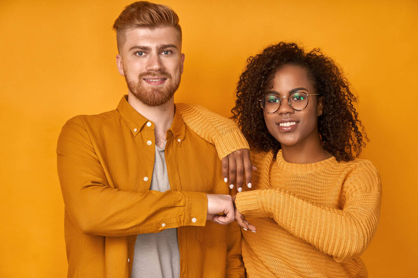 Young diverse couple gives fist bump, agree to bring the plan to life - Foto, Imagem